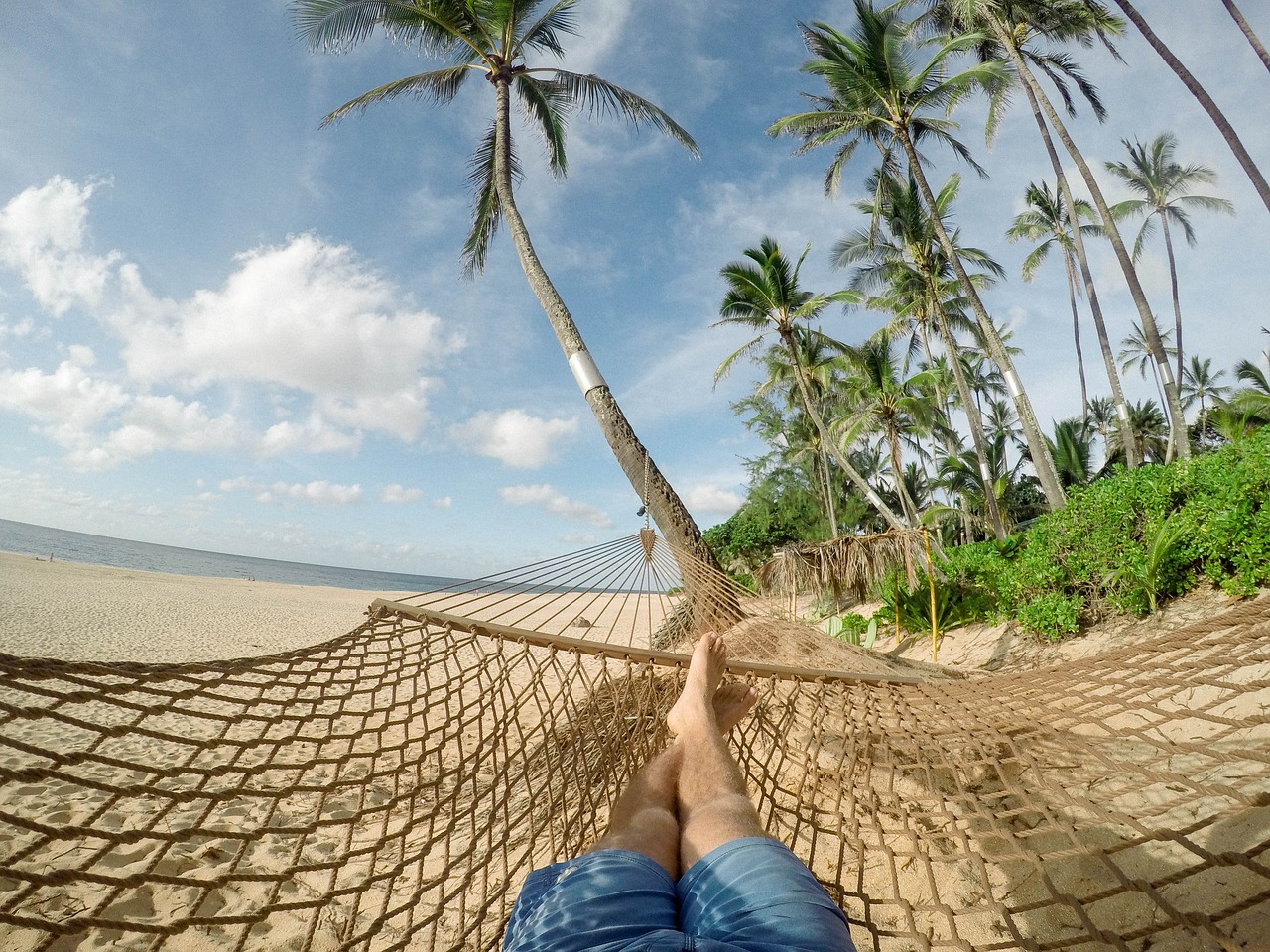 Napping on a hammock on the beach.