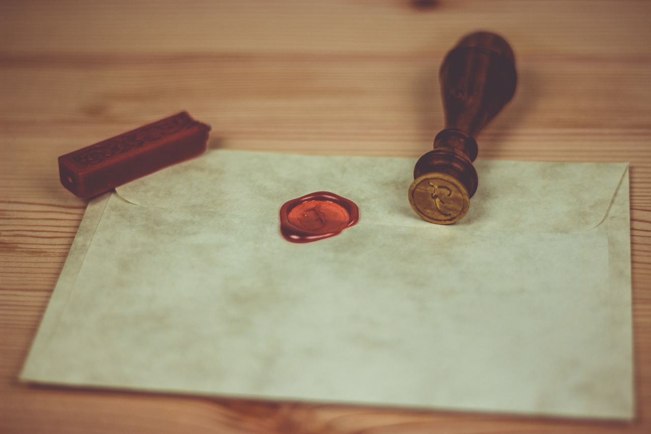 Old letter and envelope with a waxed seal.